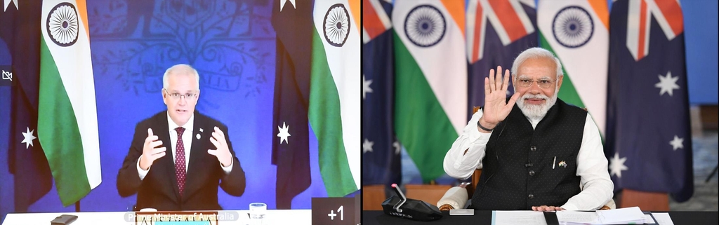 21일 화상 정상회담하는 나렌드라 모디 인도 총리(오른쪽)와 스콧 모리슨 호주 총리