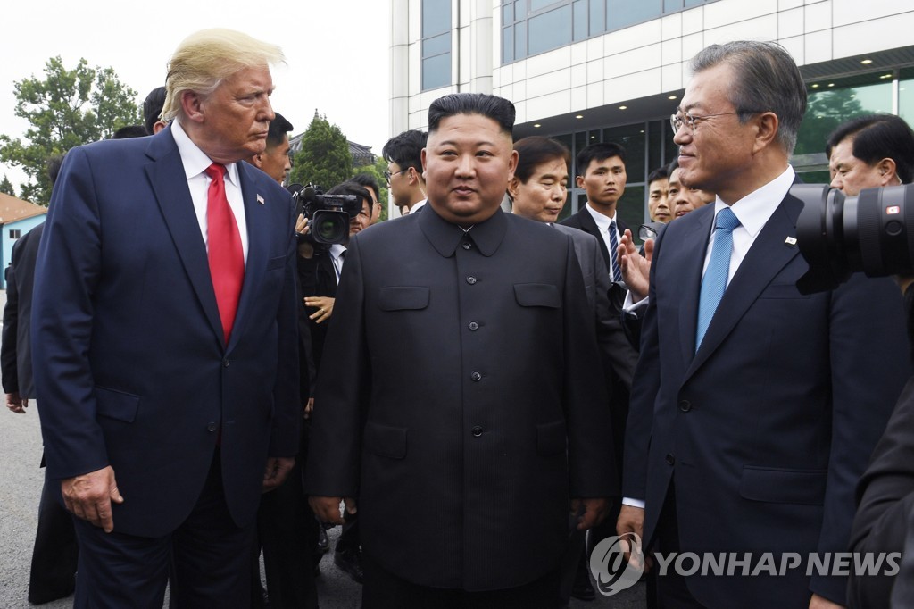 In this AP file photo from June 30, 2019, President Donald Trump (L), meets with North Korean leader Kim Jong-un (C) and South Korean President Moon Jae-in at the border village of Panmunjom in the Demilitarized Zone. (Yonhap) 