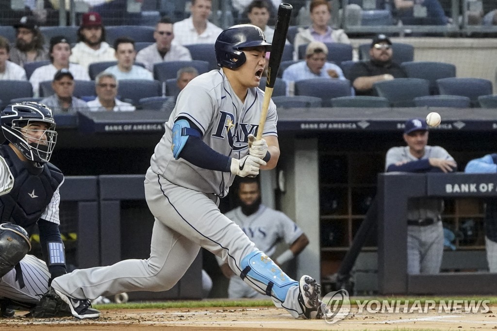 In this Associated Press photo, Choi Ji-man of the Tampa Bay Rays swings at a pitch against the New York Yankees in the top of the first inning of a Major League Baseball regular season game at Yankee Stadium in New York on June 16, 2022. (Yonhap)