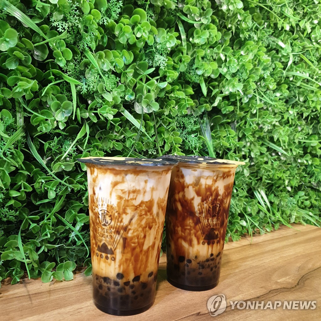 This undated file photo shows two cups of brown sugar milk tea. (Yonhap)