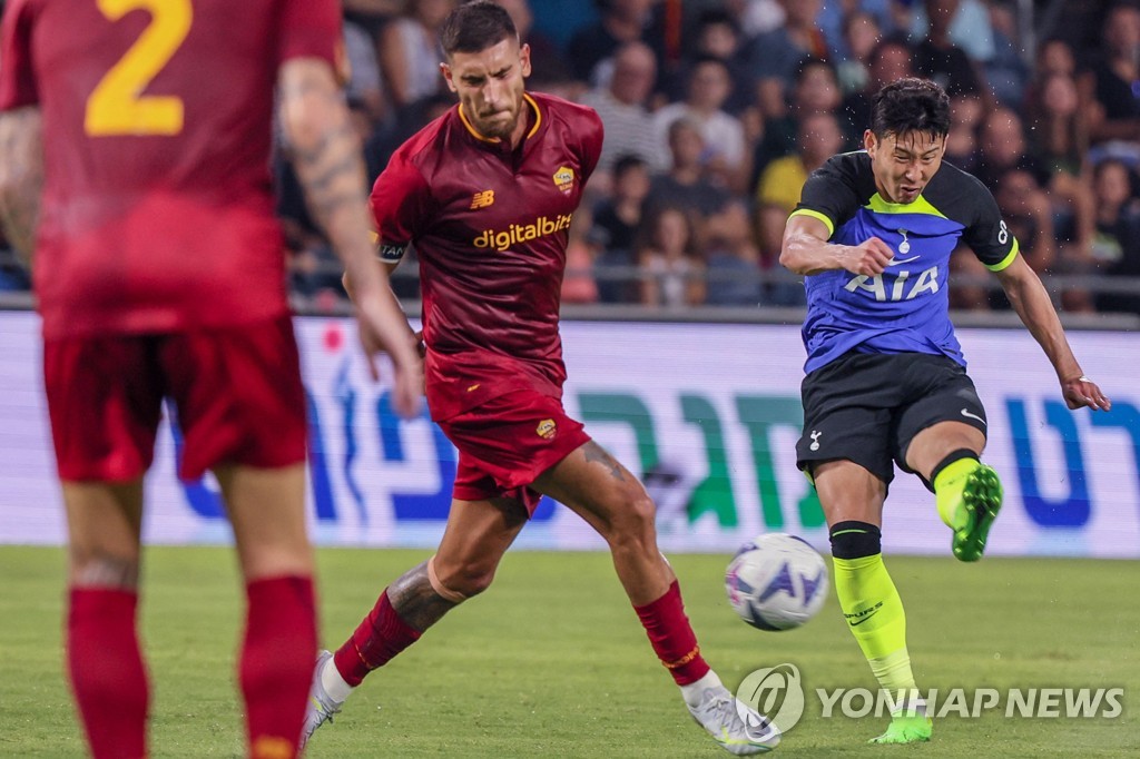 In this AFP file photo from July 30, 2022, Son Heung-min of Tottenham Hotspur (R) takes a shot against AS Roma during the clubs' preseason friendly match at Sammy Ofer Stadium in Haifa, Israel. (Yonhap)
