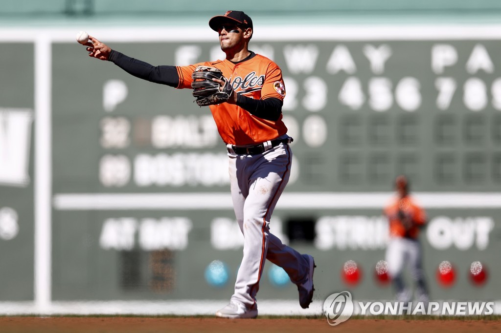 In this file photo from April 3, 2021, Rio Ruiz of the Baltimore Orioles throws to first to force out Kike Hernandez of the Boston Red Sox during the bottom of the third inning of a Major League Baseball regular season game at Fenway Park in Boston. (Yonhap)