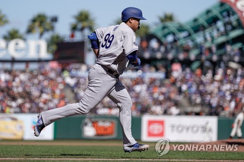 Los Angeles Dodgers starting pitcher Hyun-Jin Ryu, of South Korea, throws  to the plate during the first inning of a baseball game against the Arizona  Diamondbacks Sunday, Aug. 11, 2019, in Los