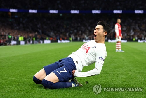 In this Reuters photo, Son Heung-min of Tottenham Hotspur celebrates after scoring a goal against Arsenal during the clubs' Premier League match at Tottenham Hotspur Stadium in London on May 12, 2022. (Yonhap)