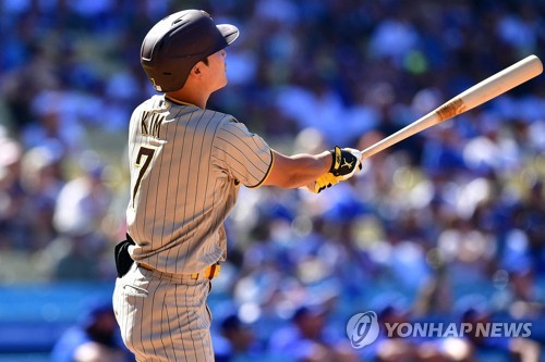 Ji Man Choi of the San Diego Padres is congratualted by Ha-Seong