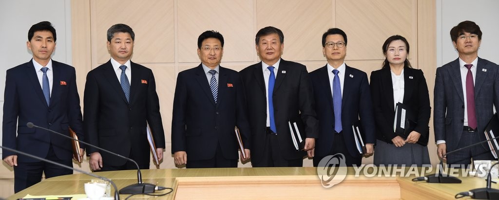 In this Joint Press Corps photo, members of South Korean and North Korean delegations prepare for the start of their sports talks at the joint liaison office in Kaesong, North Korea, on Dec. 14, 2018. (Yonhap)