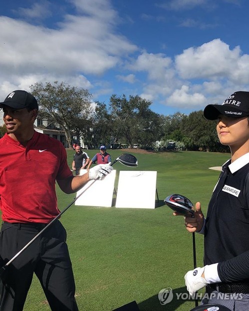 Park Sung-hyun with Tiger Woods