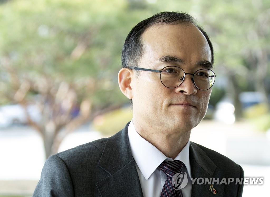 In this file photo from April 8, 2019, Prosecutor-General Moon Moo-il enters the Supreme Prosecutors' Office building in Seoul. (Yonhap)