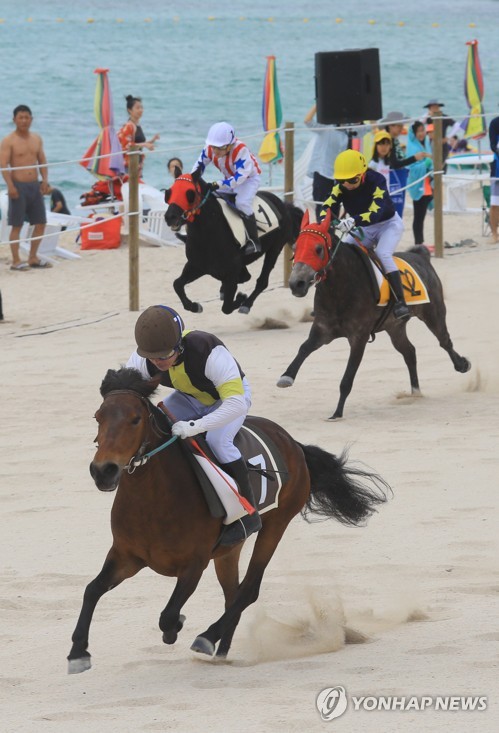 Horse race on beach