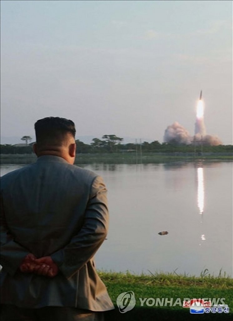 North Korean leader Kim Jong-un watches a missile launch from a site near the North's eastern coastal town of Wonsan on July 25, 2019, in this photo released by the Korean Central News Agency the following day. North Korea fired two short-range missiles into the East Sea, in what it says is a power demonstration of a "new tactical guided weapon." (For Use Only in the Republic of Korea. No Redistribution) (Yonhap)