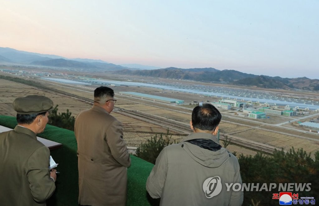 North Korean leader Kim Jong-un (C) inspects the Jungphyong Vegetable Greenhouse Farm and Tree Nursery under construction in Kyongsong County, northeastern North Korea, in this photo provided by the Korean Central News Agency on Oct. 18, 2019. (For Use Only in the Republic of Korea. No Redistribution) (Yonhap) 
