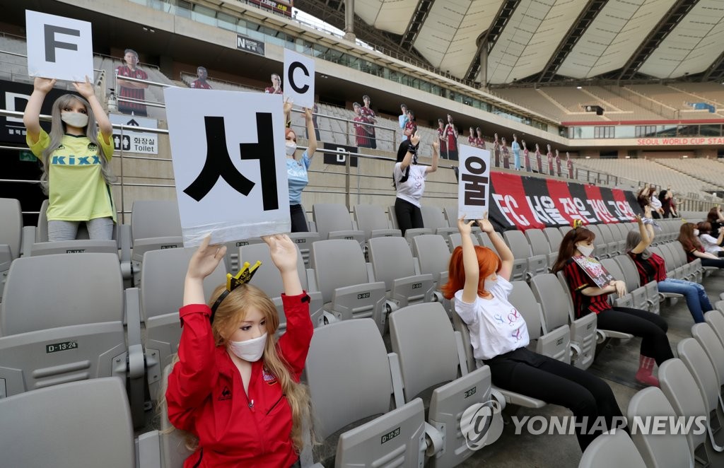 Mannequins hold up signs rooting for FC Seoul in a K League 1 match against Gwangju FC at Seoul World Cup Stadium on May 17, 2020. (Yonhap)