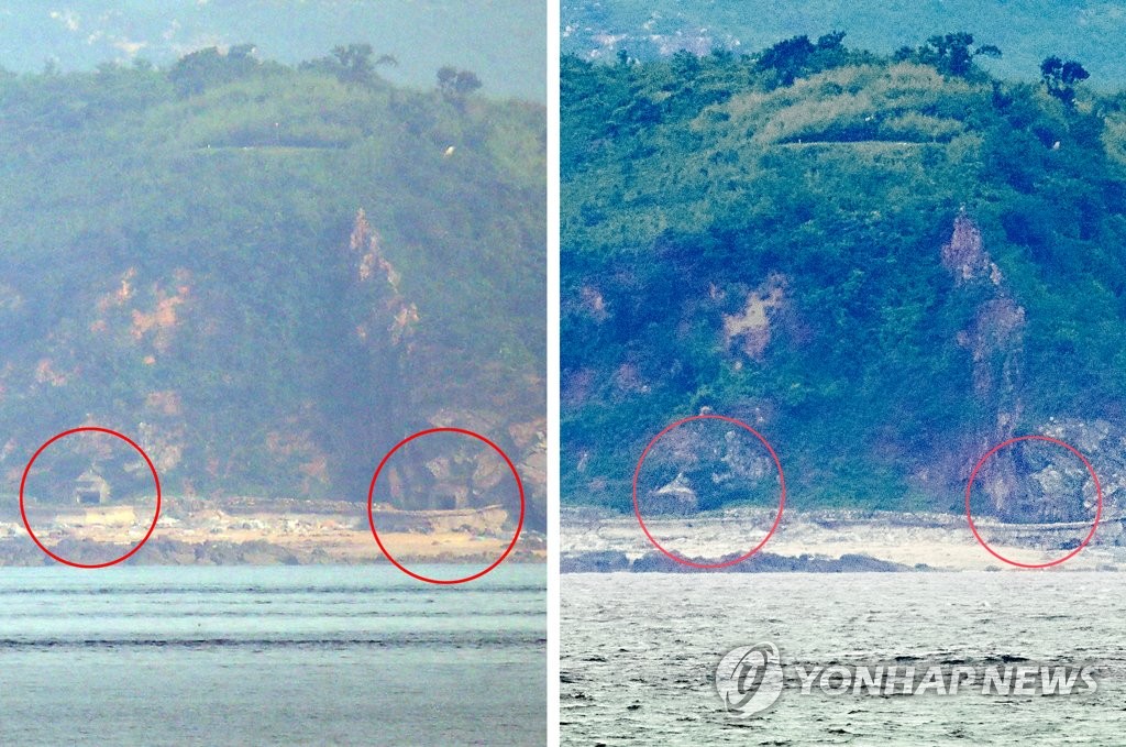 仁川の延坪島から見た北朝鮮側の海岸。右は３０日の様子で海岸砲の砲門が閉じられており、左は緊張の高まりが続いていた１９日の様子で砲門が開いた状態になっている＝３０日、延坪島（聯合ニュース）