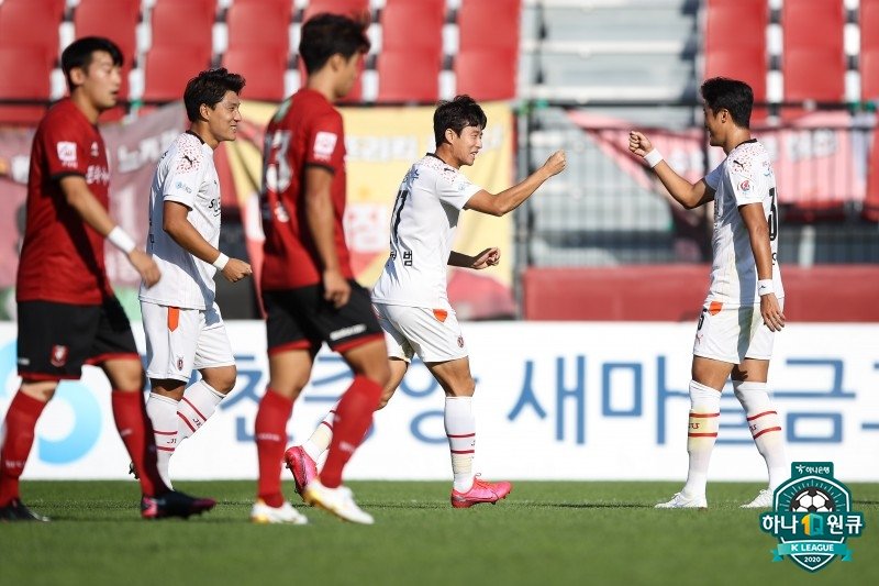In this Sept. 19, 2020, file photo provided by the Korea Professional Football League, members of Jeju United (in white) celebrate a goal during their 2-0 victory over Bucheon FC in a K League 2 match at Jeju World Cup Stadium in Seogwipo, Jeju Island. (PHOTO NOT FOR SALE) (Yonhap)