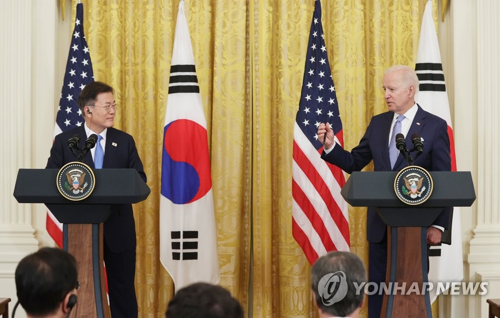 U.S. President Joe Biden (R) speaks during a joint press conference with South Korean President Moon Jae-in at the White House in Washington on May 21, 2021. (Yonhap)