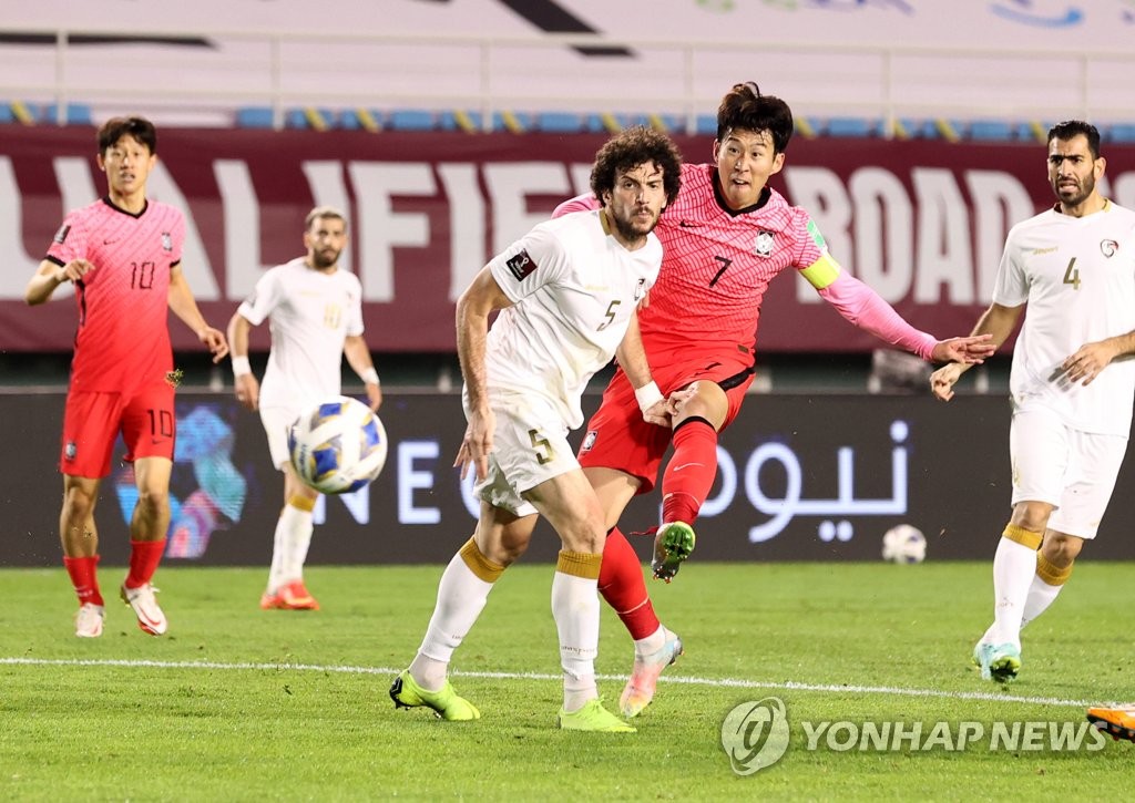 Son Heung-min of South Korea (C) takes a shot past Omar Midani of Syria (L) during the teams' Group A match in the final Asian qualifying round for the 2022 FIFA World Cup at Ansan Wa Stadium in Ansan, Gyeonggi Province, on Oct. 7, 2021. (Yonhap)