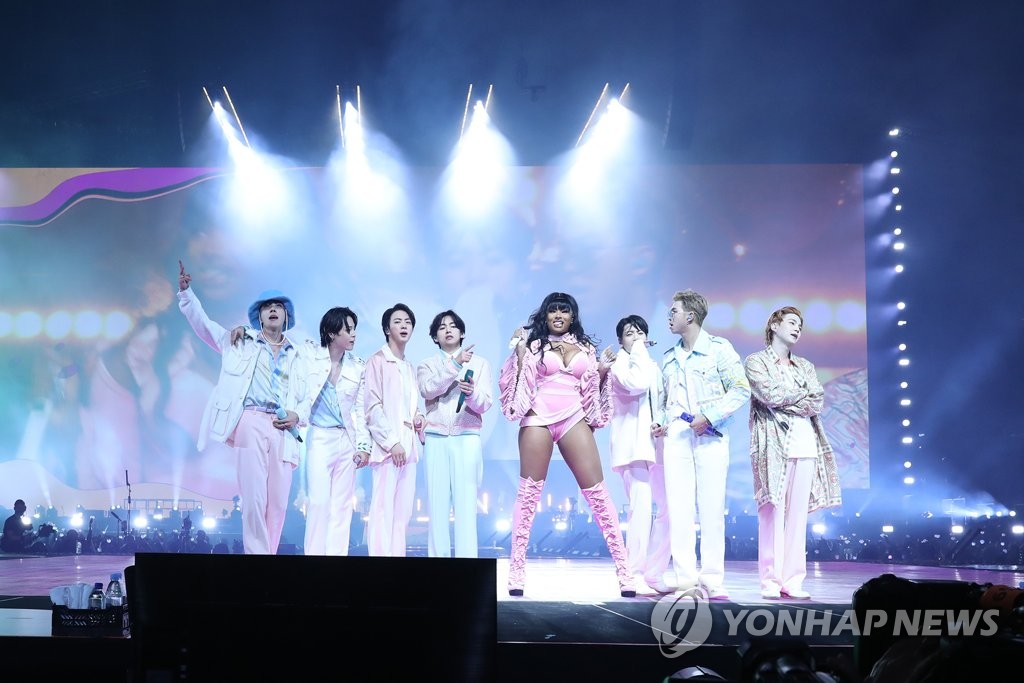 This photo, provided by Big Hit Music, shows BTS and American rapper Megan Thee Stallion performing together at SoFi Stadium in Los Angeles on Dec. 2, 2021 (U.S. time), the last of the K-pop group's four concerts there. (PHOTO NOT FOR SALE) (Yonhap)