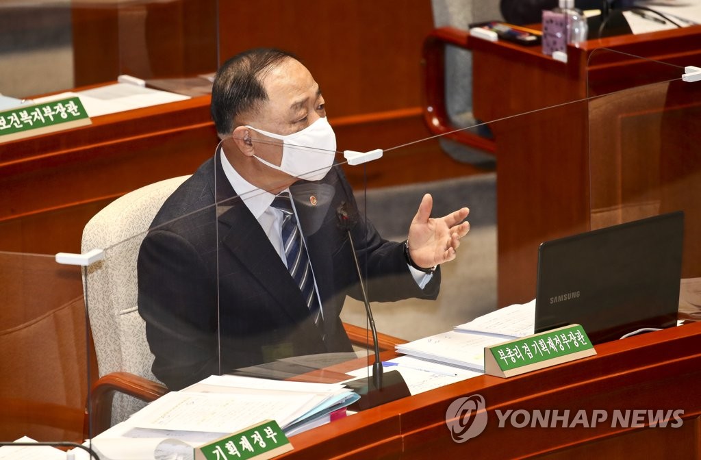 This pool photo, taken Feb. 8, 2022, shows Finance Minister Hong Nam-ki speaking at a parliamentary session over the government's proposed extra budget. (Yonhap)