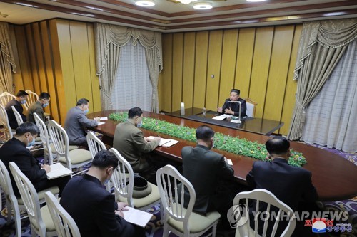 North Korean leader Kim Jong-un (rear) visits the country's national emergency quarantine command center in Pyongyang on May 12, 2022, to inspect antivirus efforts against the coronavirus pandemic, in this photo released by the North's official Korean Central News Agency. North Korea said the next day six people have died from COVID-19 and that around 18,000 people have shown symptoms of a fever, in its first release of the number of infection cases and possible cases. (For Use Only in the Republic of Korea. No Redistribution) (Yonhap)