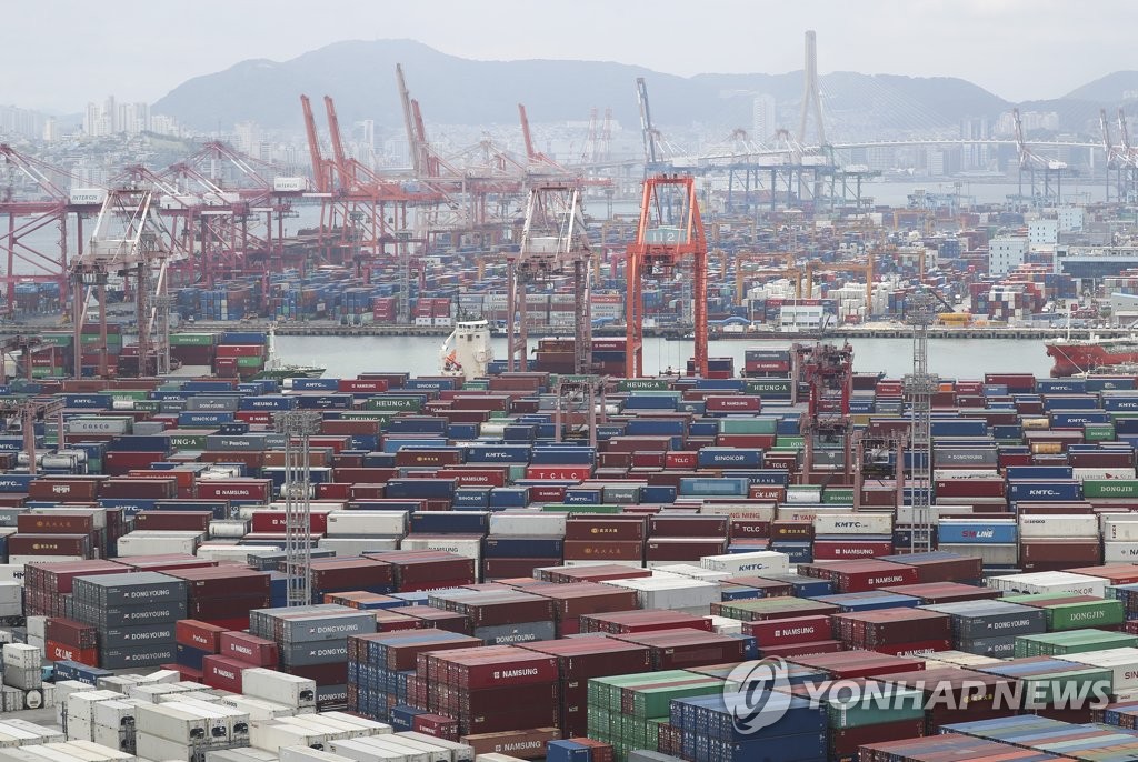 This file photo, taken June 21, 2022, shows stacks of containers at a port in South Korea's southeastern city of Busan. (Yonhap)