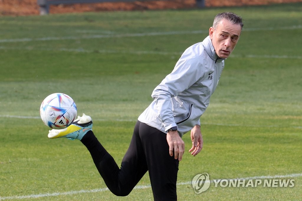 Paulo Bento, head coach of the South Korean men's national football team, kicks the ball during a training session at the National Football Center in Paju, Gyeonggi Province, on Nov. 10, 2022. (Yonhap)