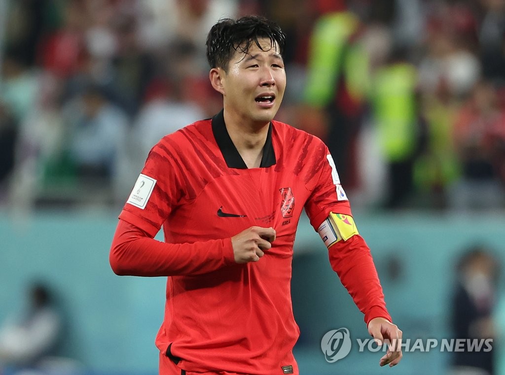 Son Heung-min of South Korea cries after his team's 2-1 victory over Portugal in a Group H match at Education City Stadium in Al Rayyan, west of Doha, that sent South Korea to the knockout stage at the FIFA World Cup on Dec. 2, 2022. (Yonhap)