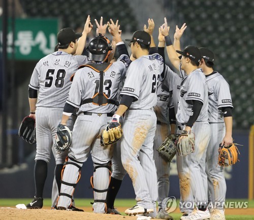 In this file photo from May 3, 2023, Hanwha Eagles players celebrate their 8-3 victory over the Doosan Bears in a Korea Baseball Organization regular season game at Jamsil Baseball Stadium in Seoul. (Yonhap)