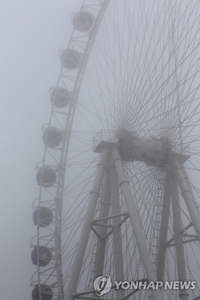 Fog-shrouded amusement park