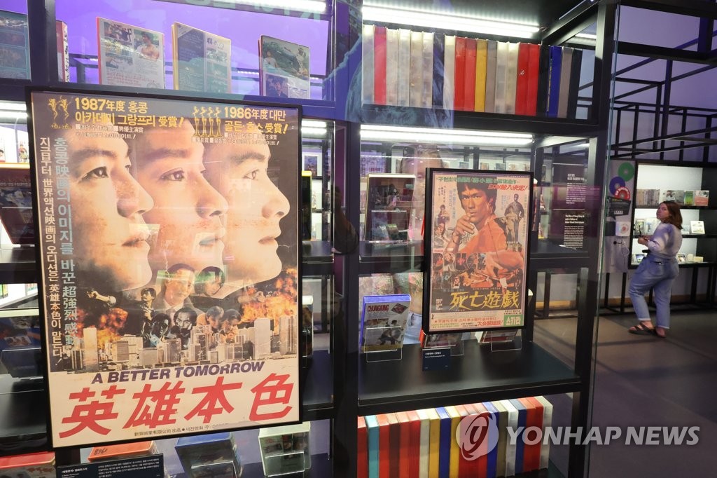 Promotional posters for hit Hong Kong movies of the 1970s and '80s are on display at an exhibition, titled "The Pop Culture We Loved, and Rise of the Korean Wave," at the National Museum of Korean Contemporary History in Seoul on July 20, 2023. (Yonhap)