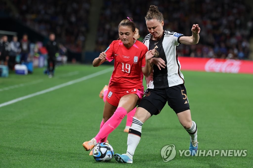 Casey Yujin Phair of South Korea (L) battles Marina Hegering of Germany for the ball during the teams' Group H match at the FIFA Women's World Cup at Brisbane Stadium in Brisbane, Australia, on Aug. 3, 2023. (Yonhap) 