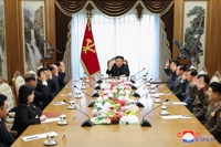 N.K. leader leads politburo meeting