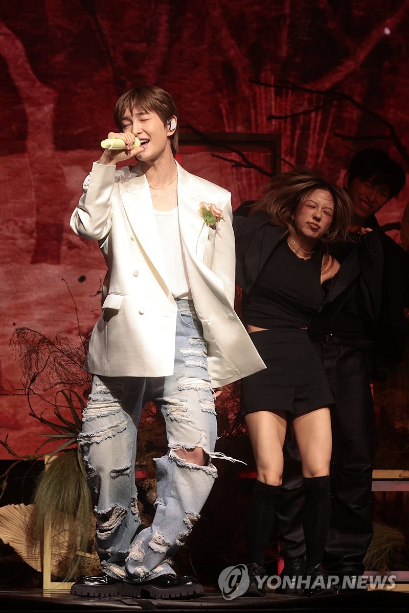 Singer Onew performs